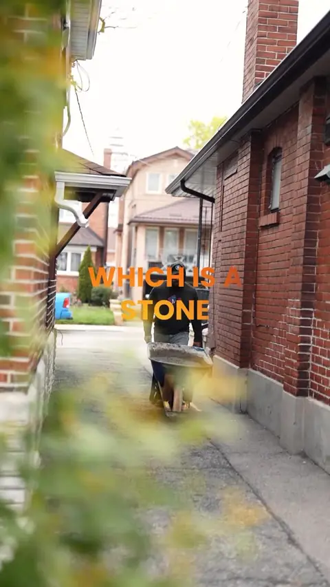 Moises beside an older brick home, quality over quantity