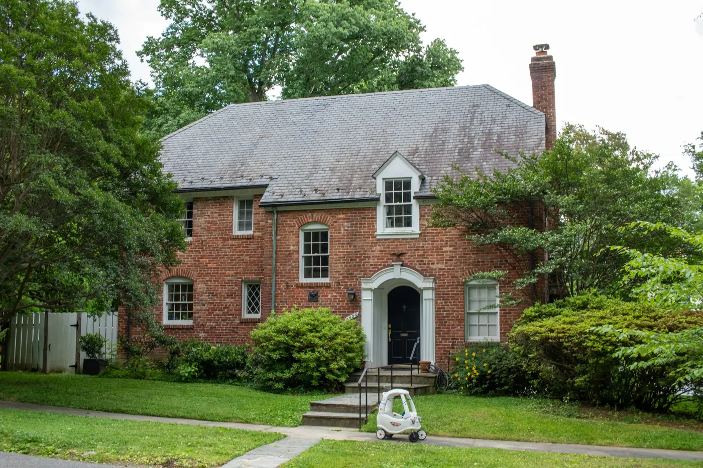 Two storey home clad front to back in red brick masonry